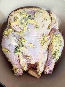 Lemon Herb Butter Roast Chicken buttered overhead