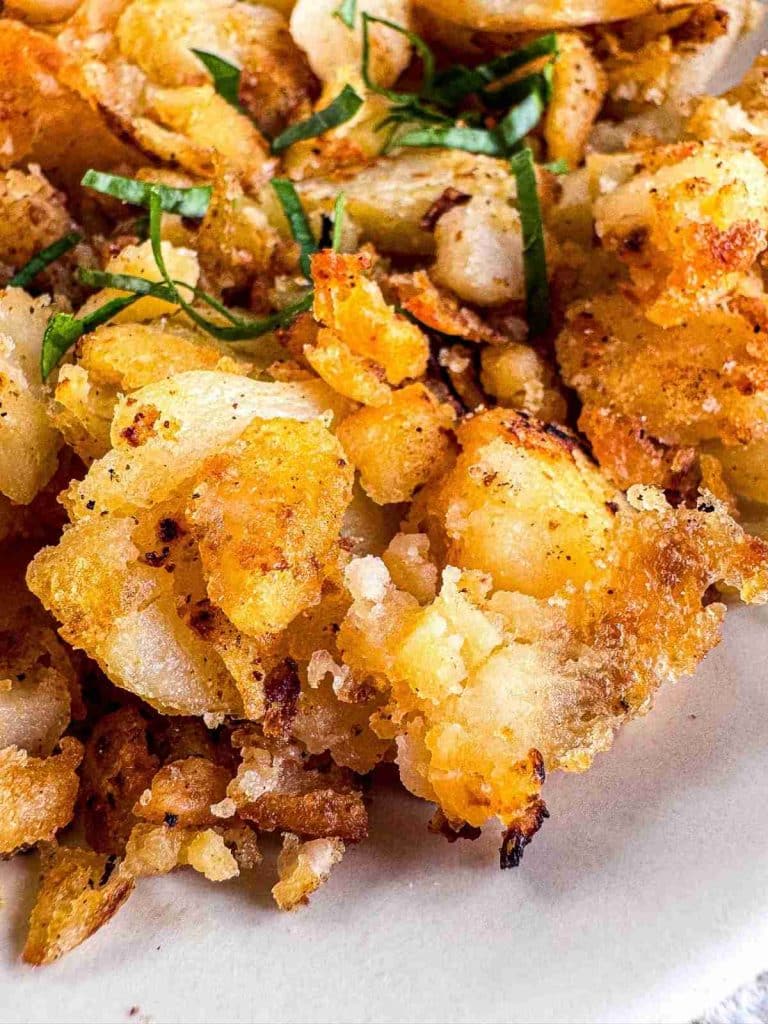 Side view of NYC Diner-Style Home Fries (No Onions) on a plate