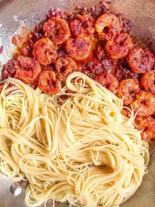 overhead view of Smoky Shrimp Pasta with Angel Hair and Sweet Onions in Skillet