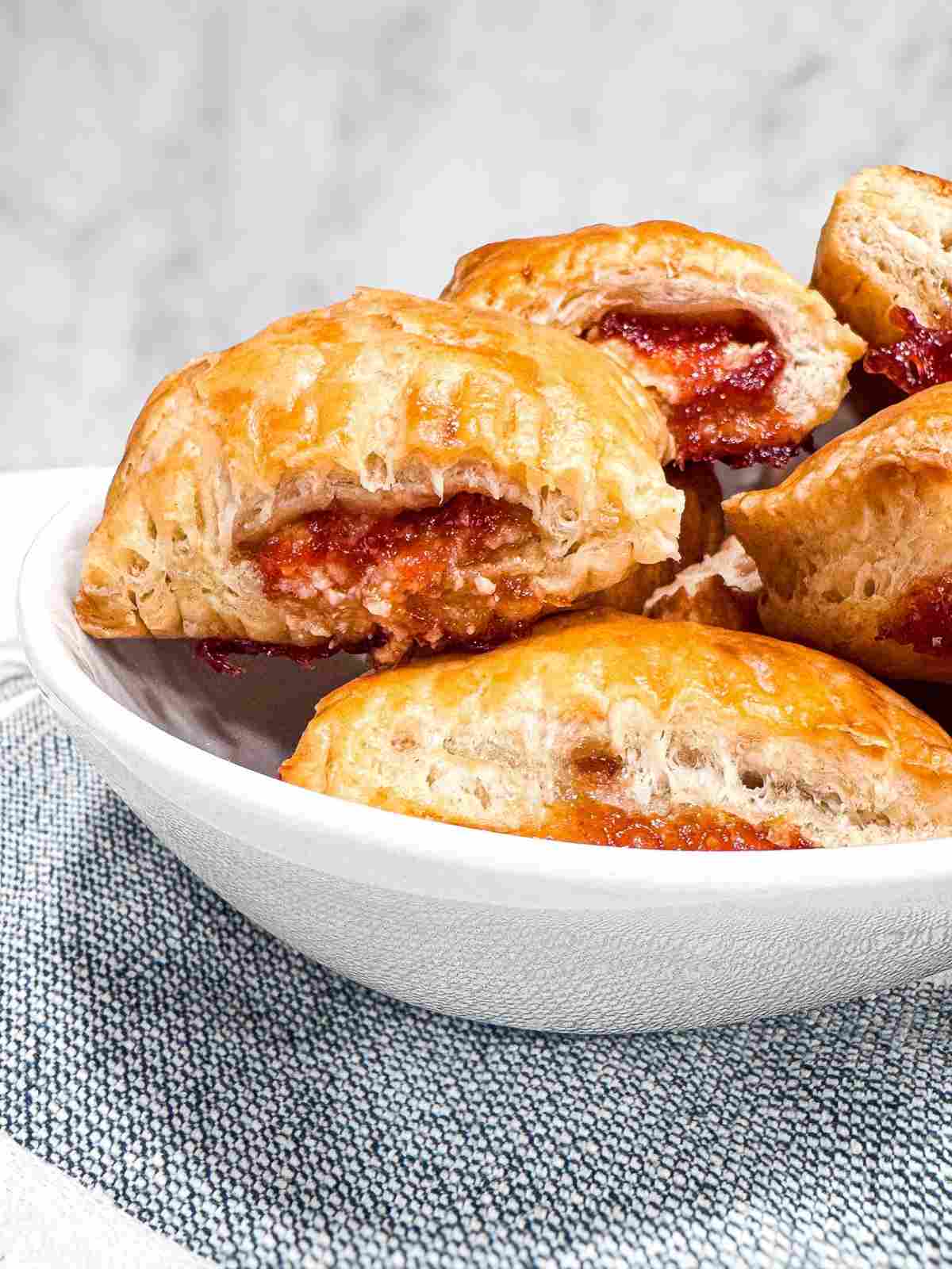 in bowl side view of 3 Ingredient Cuban Guava Pastries open pastry baked in bowl