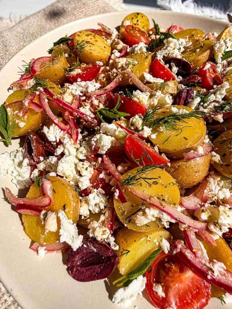 side view of Greek Potato Salad in a bowl