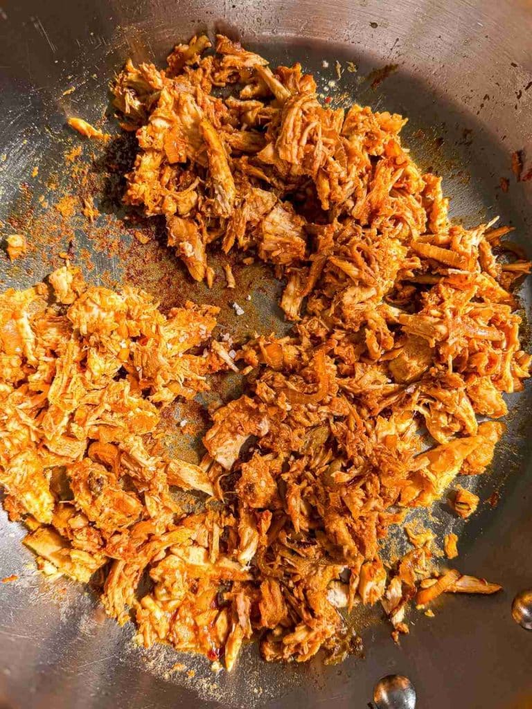 overhead view of Healthy Leftover Rotisserie Chicken and Rice shredded chicken in skillet