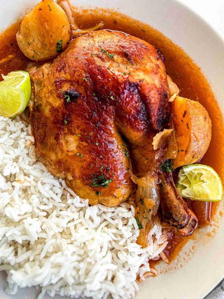 overhead view of Pot Roast Chicken Tomato Broth with fluffy white rice