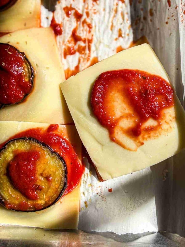 overhead view of Saucy and Cheesy Oven-Baked Eggplant Bites stacked