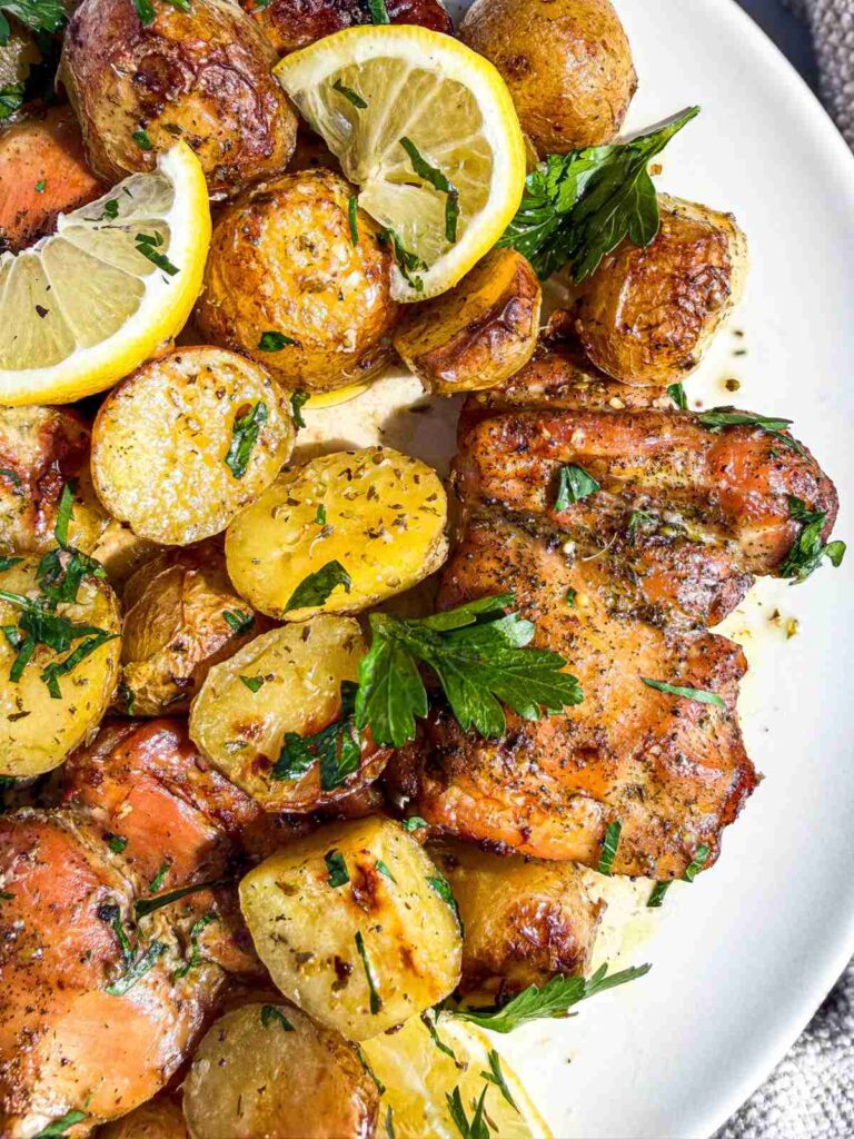 overhead view of Lemon Dill Baked Chicken Thighs and Potatoes on a dish