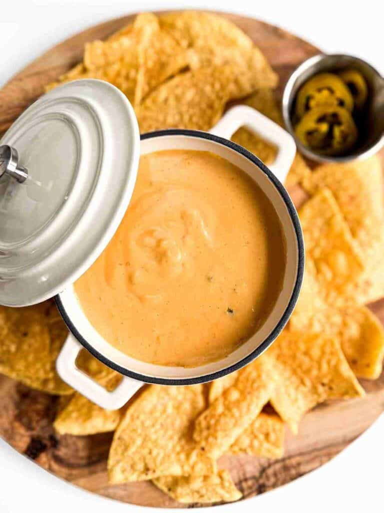 Homemade Nacho Cheese Sauce in small pot with jalapenos