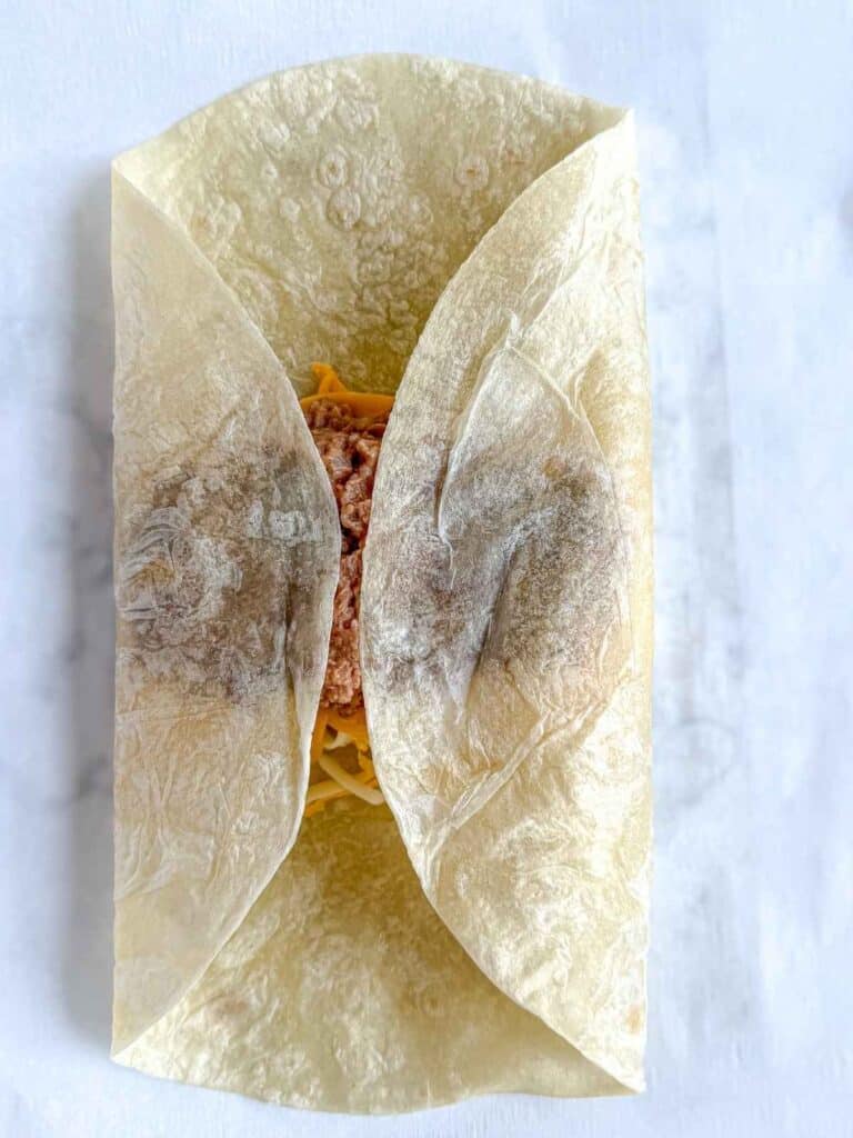 overhead view of forming bean and cheese burrito