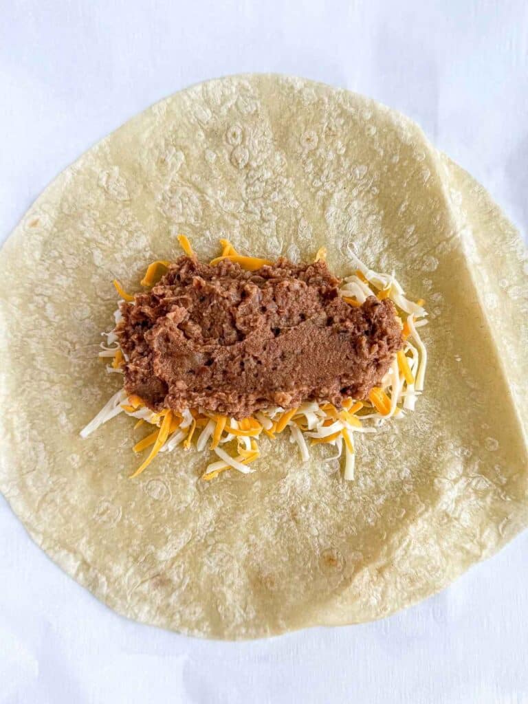 overhead view of unfolded bean and cheese burrito