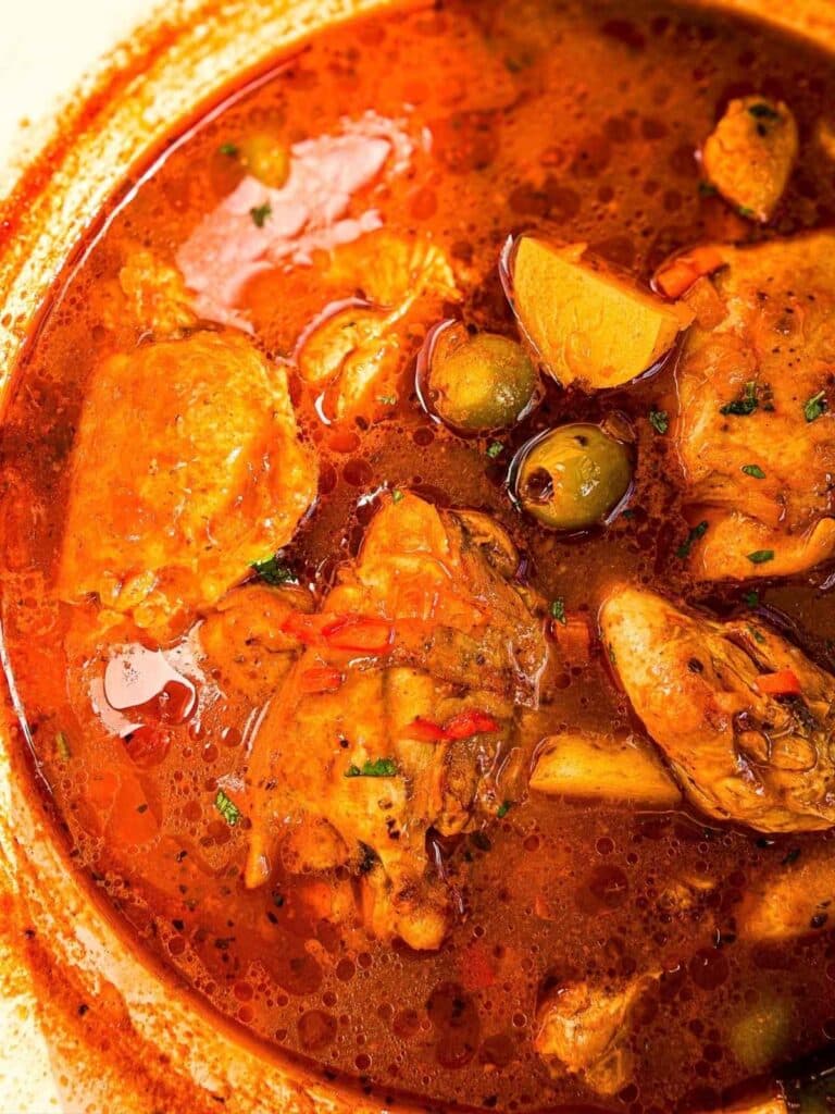 overhead view of pollo guisado in Dutch oven